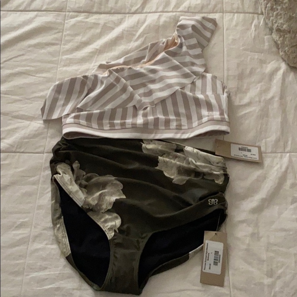 Brand new with tags Albion suit!
